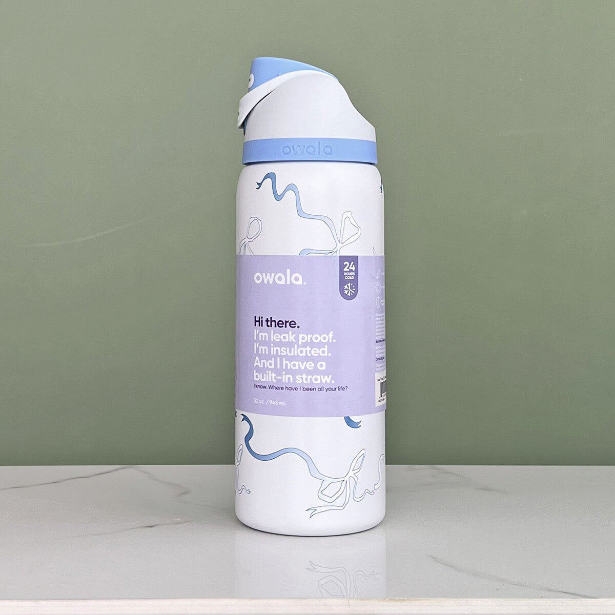 Owala FreeSip Insulated Stainless Steel Water Bottle in the "Tied and True Blue Bows" | 32oz