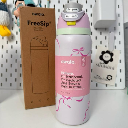 Owala FreeSip Insulated Stainless Steel Water Bottle in the "Tied and True Pink Bow" | 32oz