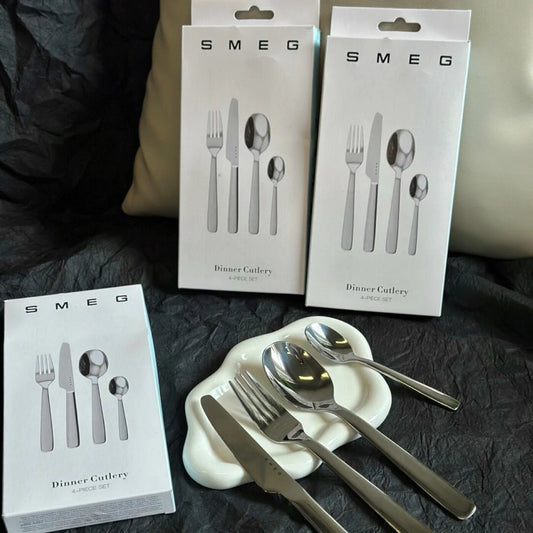 SMEG Stainless Steel 4-Piece Dinner Cutlery Set with a high-polish mirror finish