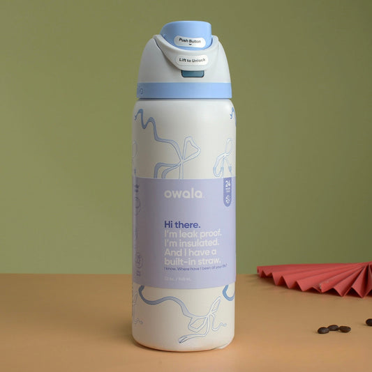 Owala FreeSip Insulated Stainless Steel Water Bottle in the "Tied and True Blue Bows" | 32oz