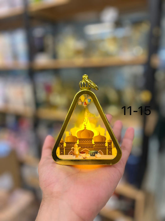 Handheld Golden Triangular Ramadan Lantern with Miniature Mosque Silhouette and LED Glow